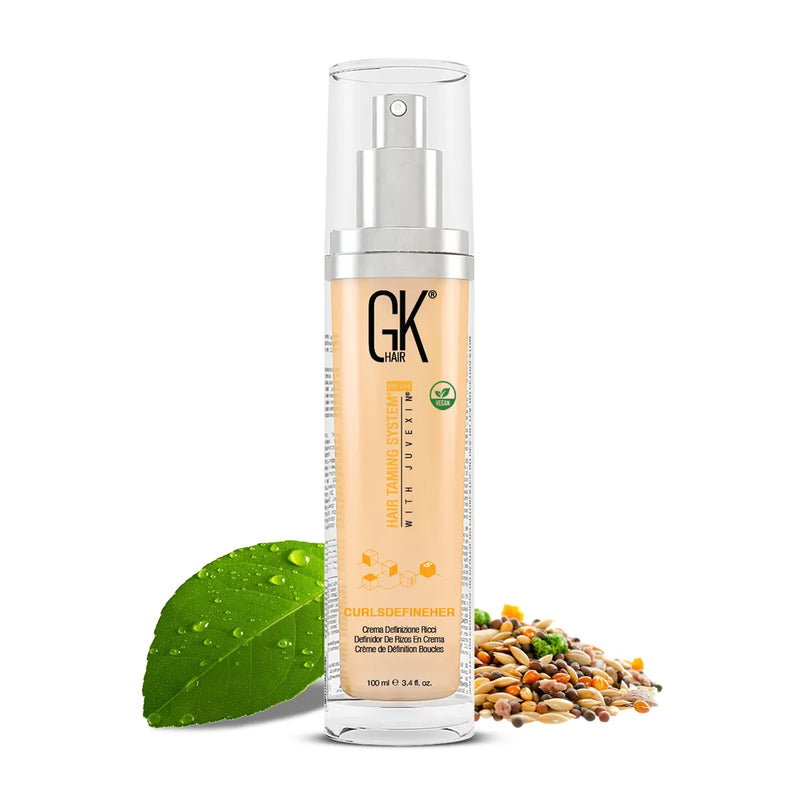 GK Hair CurlsDefineHer Pro curl defining cream 100 ml pump bottle, front view with a green leaf and mixed seeds