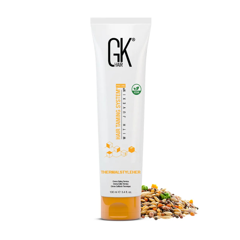 GK Hair ThermalStyleHer Cream 100 ml tube beside a scatter of natural seeds and grains