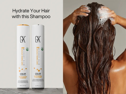 Moisturizing shampoo and conditioner bottles beside a woman massaging foamy shampoo into wet hair. Text: “Hydrate Your Hair with this Shampoo.”