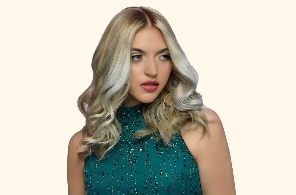 A Lady with a Ash Blonde Hair with a green top
