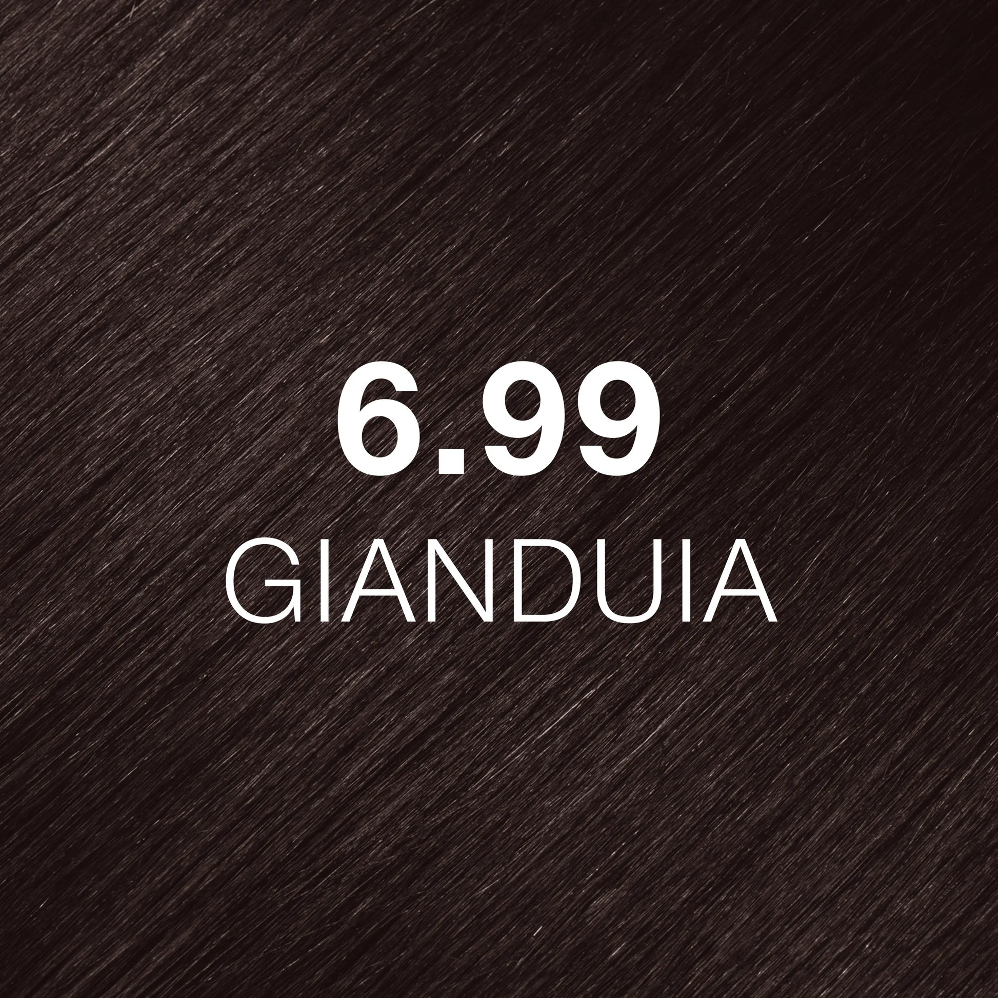 Silky hair texture showcasing the GK Hair's Juxevin Cream Color "6.99 Gianduia" in bold white text.