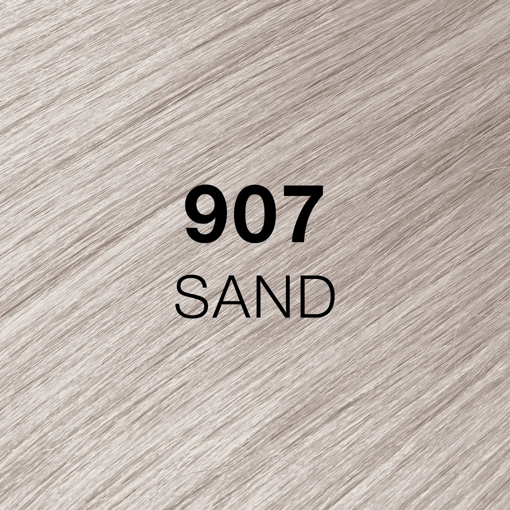 Silky hair texture showcasing the GK Hair's Juxevin Cream Color "907 Sand" in bold white text.