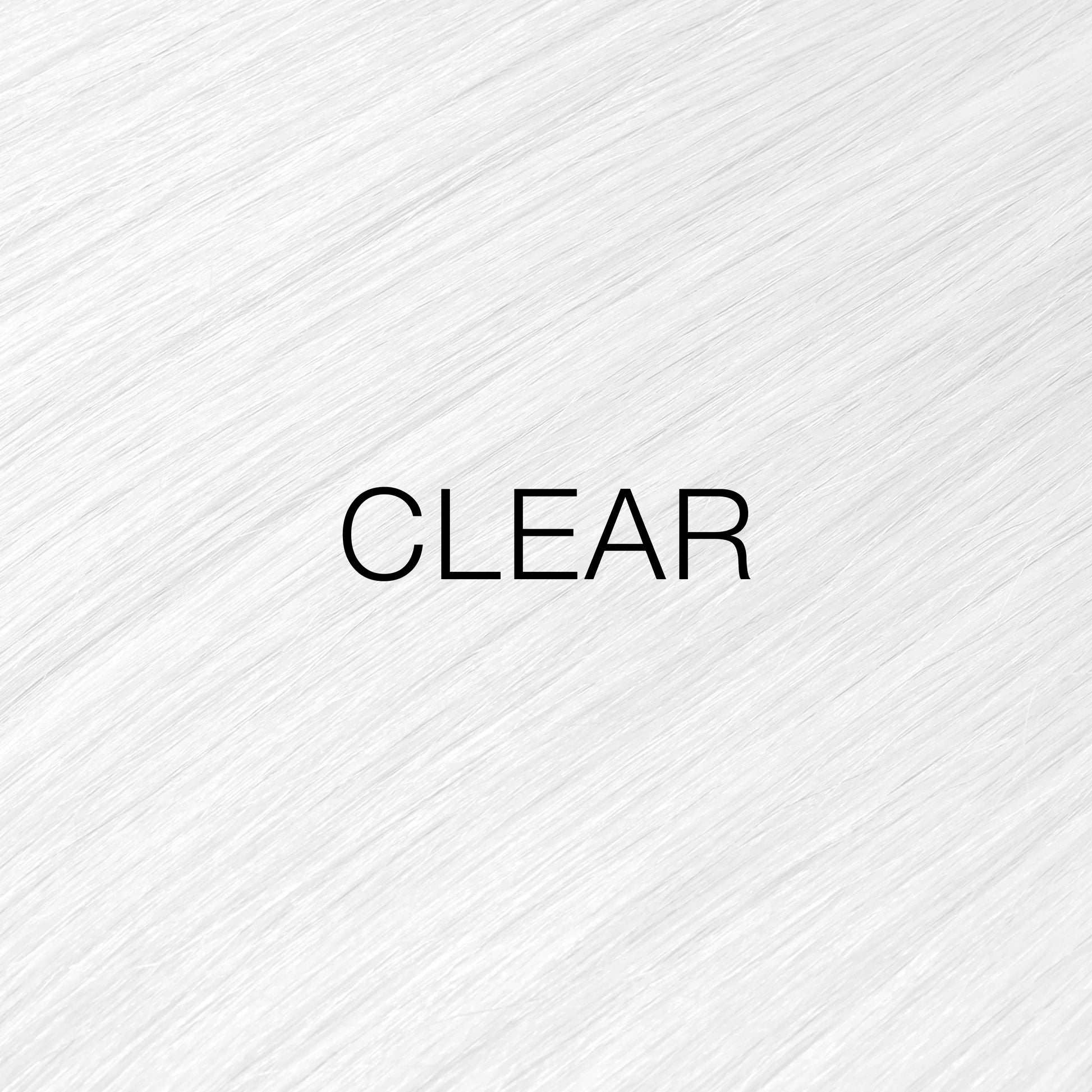Silky hair texture showcasing the GK Hair's Juxevin Cream Color "Clear Mixtones" in bold white text.